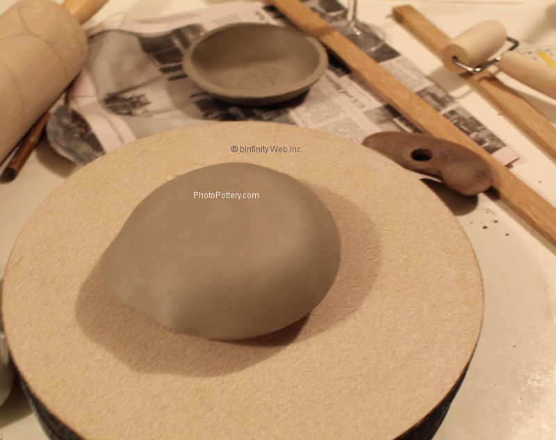 Drape slab clay on hump mold