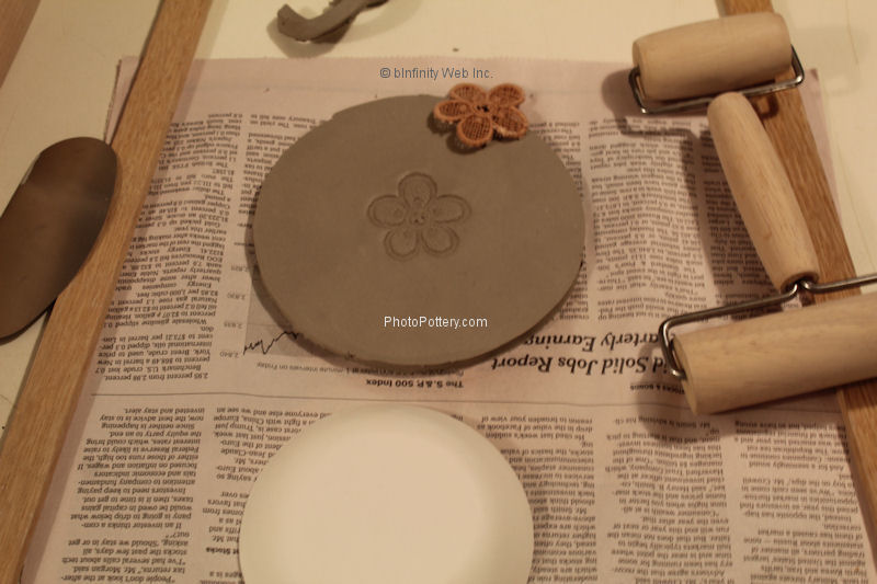 Press design into clay using pony roller