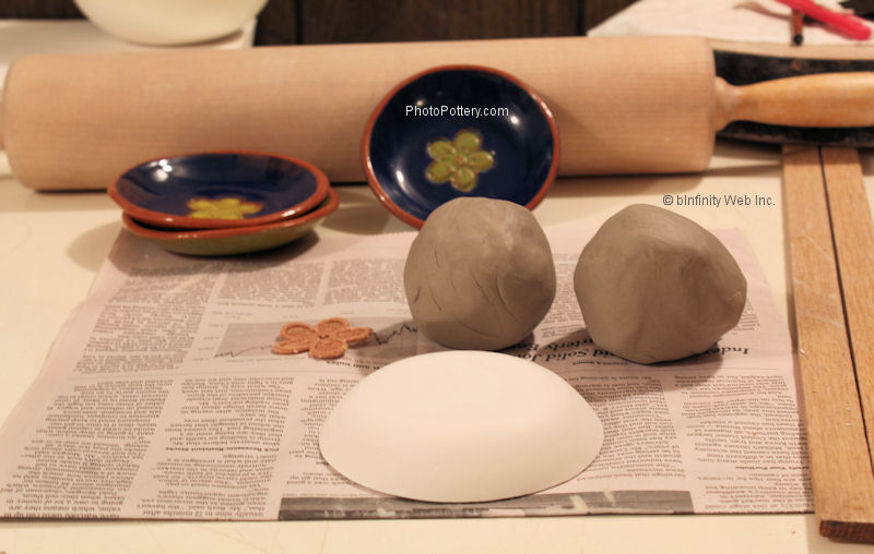 Setting up to roll out clay to drape on mold