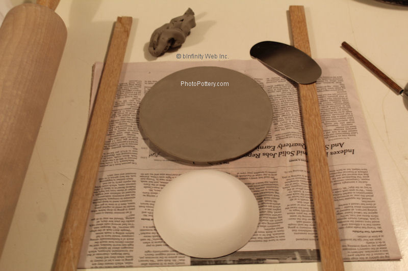 Cut round clay slab approximately sized to the plaster hump mold.