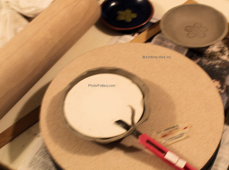 Trim off excess clay on the rim
