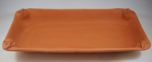 Serving/decorative platter made on rectangular hump mold. This bisqued earthenware pottery is not yet glazed.
