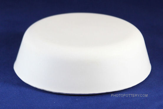 Plaster drape mold for making ceramic cat food and water bowls. Mold is shown inverted. 