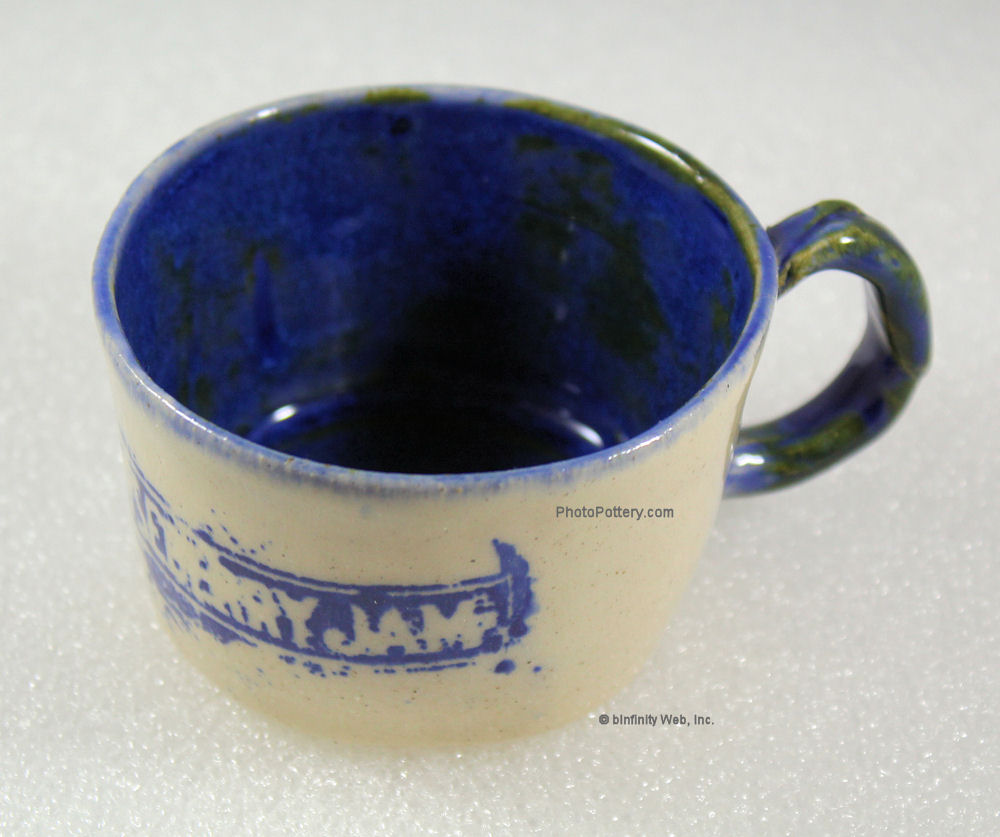 Sample teacup made using bottom 2 inches of large cup mold. Stoneware, glazed.