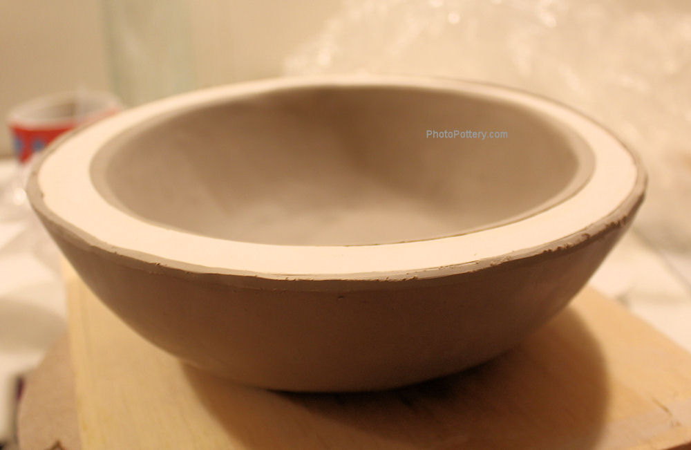 Two pottery bowls made at the same time on the same mold! The inside bowl is slumped, the outside humped. Greenware, White Stoneware