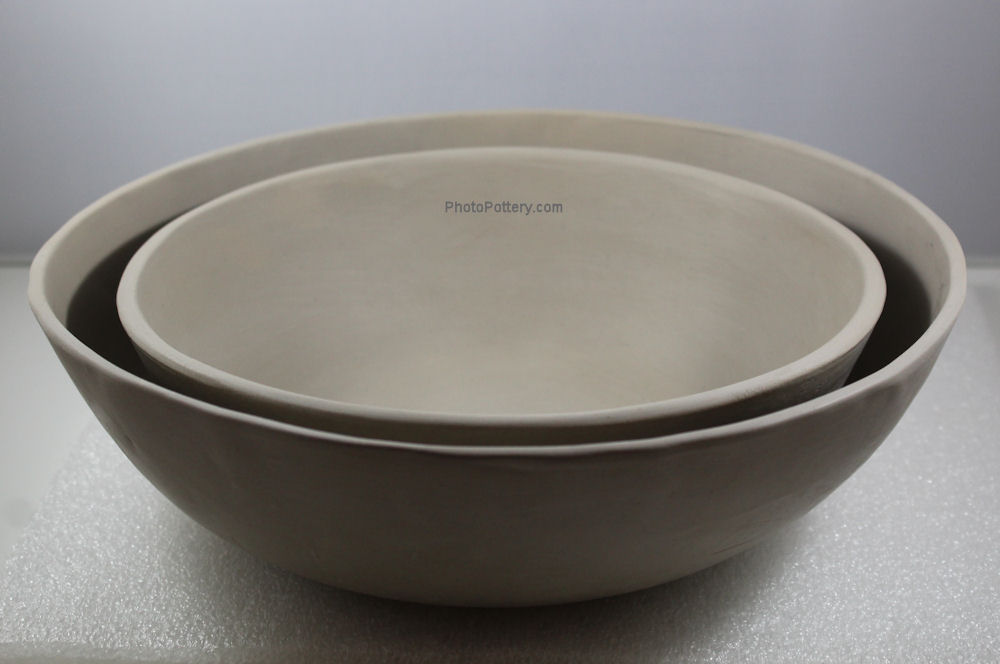 Two simple slab bowls made on the combo hump slump mold. Larger bowl draped on hump mold, the smaller slumped on the inside