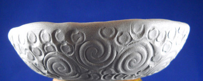 TextureRing™ to add designs to clay, such as border patterns on bowls